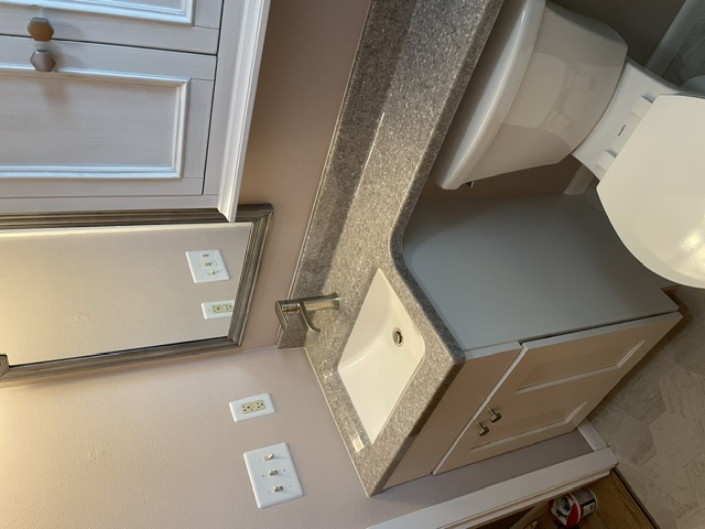 Updated bathroom vanity, faucet, and toilet installation